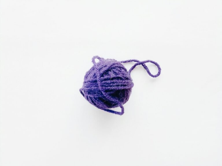 Natural brown cotton yarn wound on a pale surface